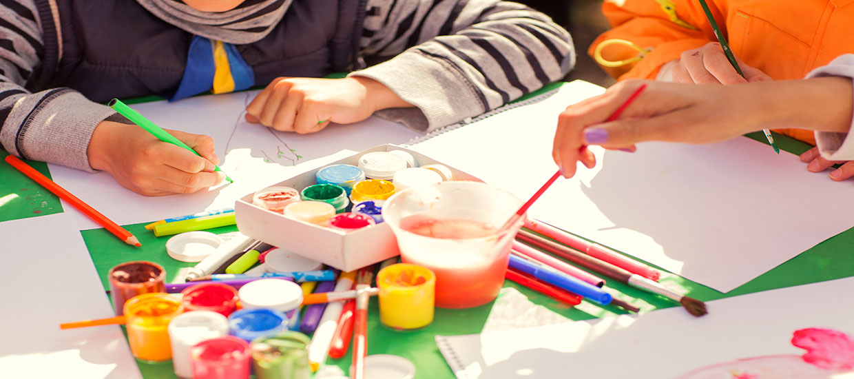 This is a stock photo. An up close view of an arts and crafts table.